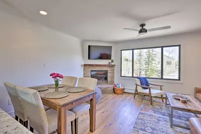 a dining room with a table and chairs and a fireplace at Frisco Mountain Hub Walk to Main Street in Frisco