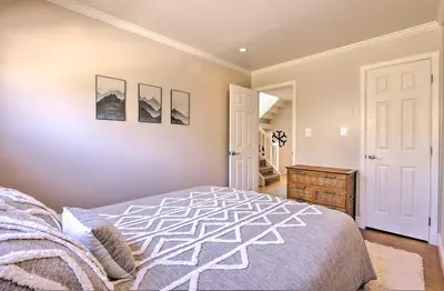 a bedroom with a bed and a wooden dresser at Frisco Mountain Hub Walk to Main Street in Frisco