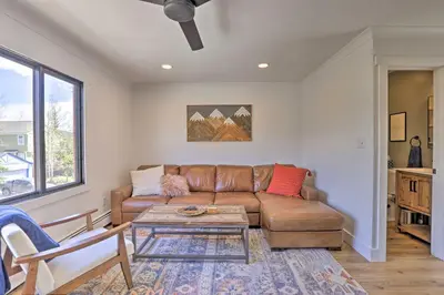 a living room with a couch and a table at Frisco Mountain Hub Walk to Main Street in Frisco