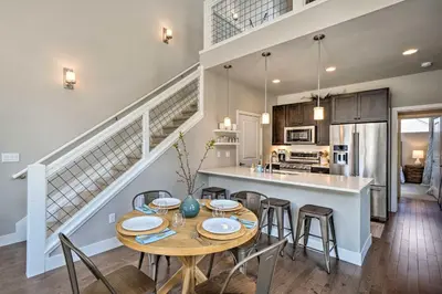 a kitchen and dining room with a table and chairs at Rendezvous Buckhorn Cabin By Hiking Trails in Winter Park