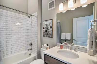 a bathroom with a sink and a tub and a toilet at Rendezvous Buckhorn Cabin By Hiking Trails in Winter Park