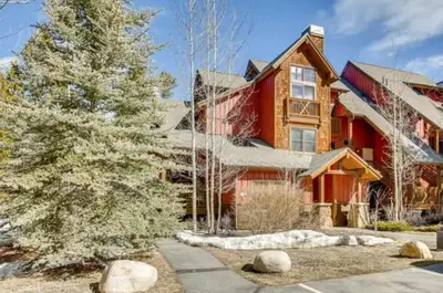 a house with a christmas tree in front of it at Lakeside Village 3 Bedroom Townhome At The Seasons In Keystone in Dillon