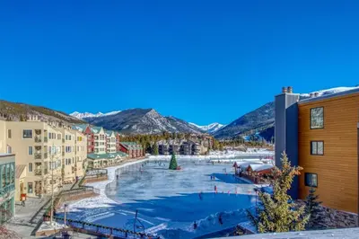 a resort with a pool in the middle of a city at Lakeside Village 3 Bedroom Townhome At The Seasons In Keystone in Dillon