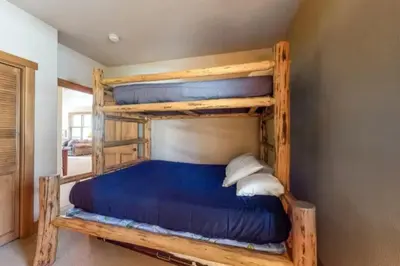 a bedroom with two bunk beds in a room at Red Hawk Townhomes 2 Bedroom Rental In River Run Village in Dillon