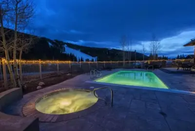 a hot tub in the middle of a patio at Red Hawk Townhomes 2 Bedroom Rental In River Run Village in Dillon