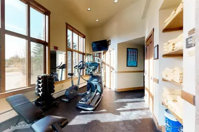 a fitness room with treadmills and a gym at Red Hawk Townhomes 2 Bedroom Rental In River Run Village in Dillon