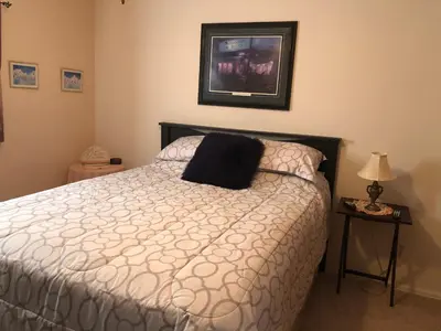 a bedroom with a bed with a black pillow on it at 1 or 2 bedrooms with bath at Indian Peaks golf course in Lafayette