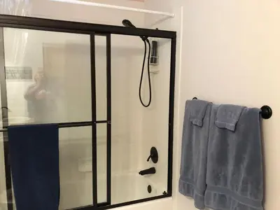 a shower with a glass door in a bathroom at 1 or 2 bedrooms with bath at Indian Peaks golf course in Lafayette
