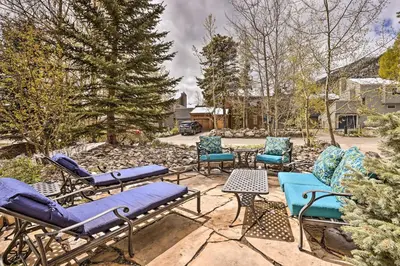 a group of chairs and tables on a patio at Walk to Frisco Main St Townhome Steps to Trail! in Frisco