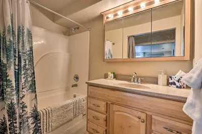 a bathroom with a tub and a sink and a shower at Walk to Frisco Main St Townhome Steps to Trail! in Frisco