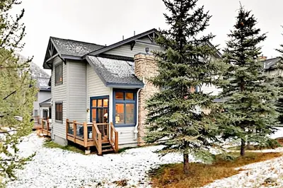 a home in the snow with a pine tree at Family Friendly 3 Bedroom Vacation Rental In West Keystone Resort Along The Snake River With Pool And Hot Tub in Keystone