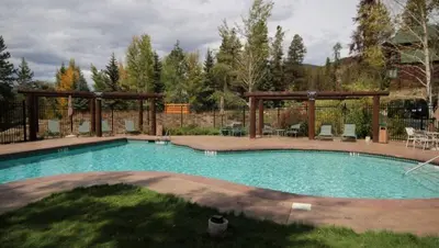 a swimming pool in a yard with a gazebo at Family Friendly 3 Bedroom Vacation Rental In West Keystone Resort Along The Snake River With Pool And Hot Tub in Keystone