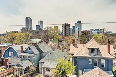 a group of houses in a city with a city skyline at Rooftop Deck and City Views Denver Abode! in Denver