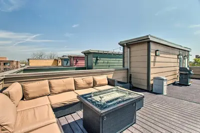 a couch sitting on top of a roof at Rooftop Deck and City Views Denver Abode! in Denver