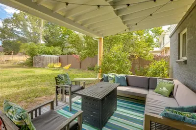 a patio with a couch and a table at The Modern Ridge House with Yard in Wheat Ridge in Wheat Ridge