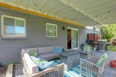 a patio with a couch and a table at The Modern Ridge House with Yard in Wheat Ridge in Wheat Ridge