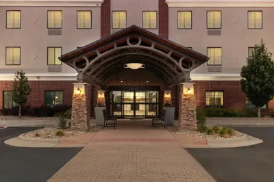 a building with an archway in front of it at Staybridge Suites Denver - Central Park by IHG in Denver