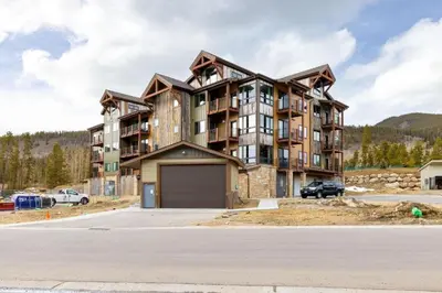 an apartment building under construction with a garage at 202 Clearwater Lofts condo in Keystone