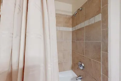a bathroom with a shower with a shower curtain at Antlers Gulch #304 in Keystone