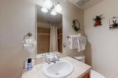 a bathroom with a sink and a mirror at Antlers Gulch #304 in Keystone