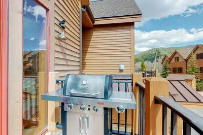 a grill on the balcony of a house at Antlers Gulch #304 in Keystone