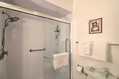 a bathroom with a shower with a glass door at Rocky Mountain Breezes Cabin Grill and Deck! in Estes Park
