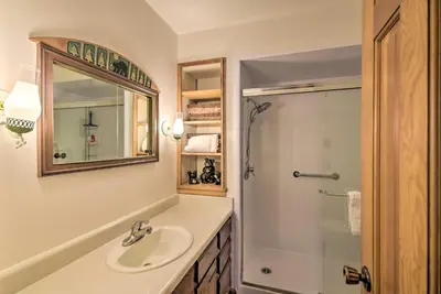 a bathroom with a sink and a shower at Rocky Mountain Breezes Cabin Grill and Deck! in Estes Park