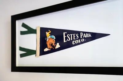 a picture of a sign on a wall at Misty Mountain Lodge in Estes Park