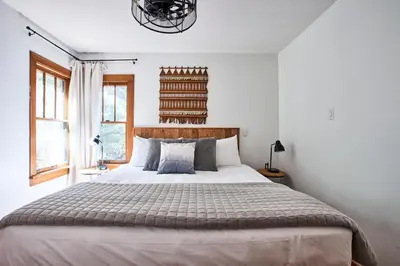 a bedroom with a large bed and a window at Misty Mountain Lodge in Estes Park