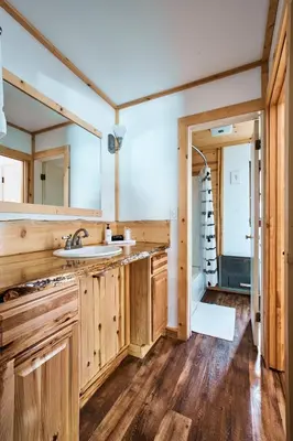a bathroom with a sink and a mirror at Misty Mountain Lodge in Estes Park