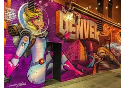 a wall with a painting of a woman on it at Sloans Lake Getaway - Basement Apartment Near Broncos and Downtown Denver in Lakewood