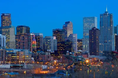 a view of a city skyline at night at Sloans Lake Getaway - Basement Apartment Near Broncos and Downtown Denver in Lakewood
