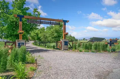 a garden with a sign that reads outdoor market at Llama-Stay at Spooky Tooth Ranch - Mtn Views! in Loveland