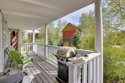 a patio with a grill on a porch at Spacious Townhome Near Main St and Lake Dillon! in Frisco