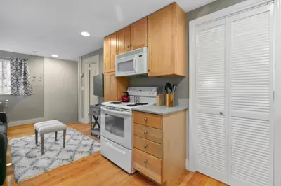 a kitchen with a stove and a microwave at 1147 Vine St in Denver