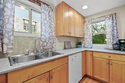 a kitchen with a sink and two windows at 1147 Vine St in Denver