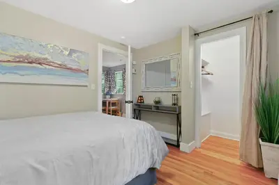 a bedroom with a bed and a desk and a window at 1147 Vine St in Denver