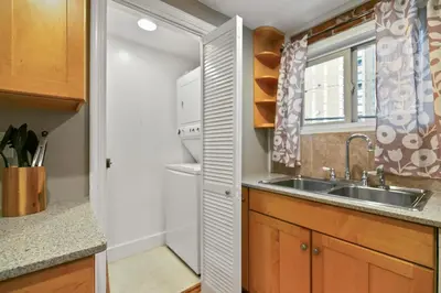 a kitchen with a sink and a refrigerator at 1147 Vine St in Denver