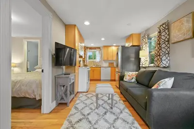 a living room with a couch and a bed at 1147 Vine St in Denver