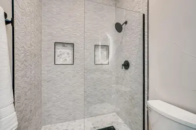 a shower stall with two pictures in a bathroom at 1020 E 24th Ave in Denver