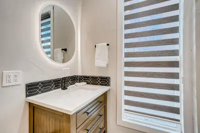 a bathroom with a sink and a mirror at 1020 E 24th Ave in Denver