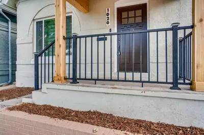 a house with a blue gate on a porch at 1020 E 24th Ave in Denver
