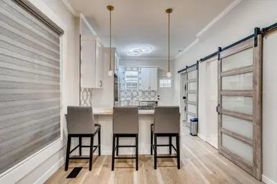 a kitchen with a table and chairs in a room at 1020 E 24th Ave in Denver