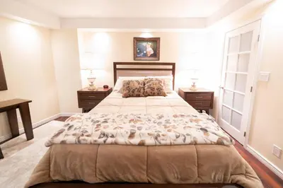 a bedroom with a large bed and two night stands at 1777 Larimer St #1911 in Denver
