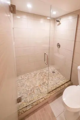 a shower with a glass door in a bathroom at 1777 Larimer St #1911 in Denver