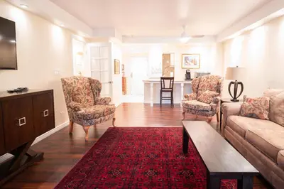 a living room with a couch and chairs and a table at 1777 Larimer St #1911 in Denver