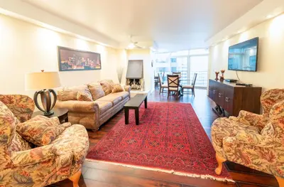 a living room with a couch and a table at 1777 Larimer St #1911 in Denver
