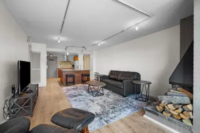 a living room with a couch and a fireplace at 1777 Larimer St #903 in Denver