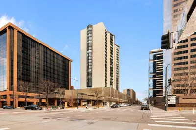 an empty street in a city with tall buildings at 1777 Larimer St #903 in Denver