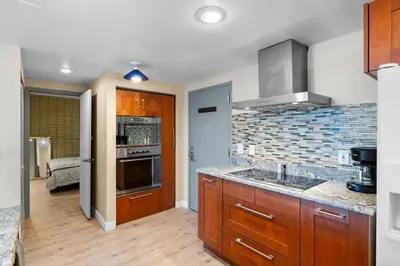 a kitchen with a sink and a stove top oven at 1777 Larimer St #903 in Denver